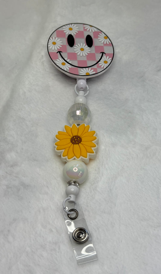 BR12 Smiley Face with Daisies badge real