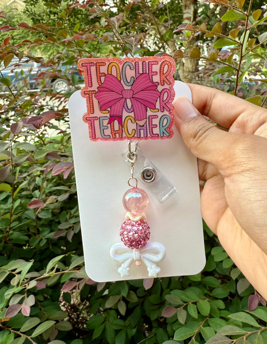 BR55 Teacher with pencil bow badge reel